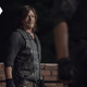The leather-clad Daryl (Norman Reedus) stares at the back of the unhinged commander Pope in AMC's The Walking Dead.